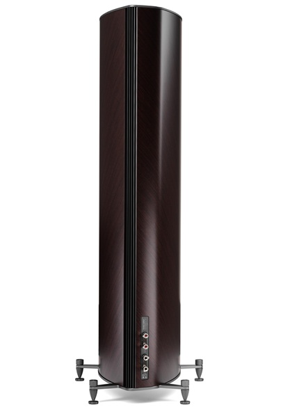 Tall floor-standing speaker with dark wood veneer on a metal stand, rear panel with audio input ports/speakers connectors visible.